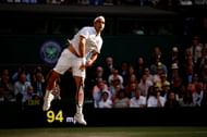 Roger Federer serves at 2019 Wimbledon